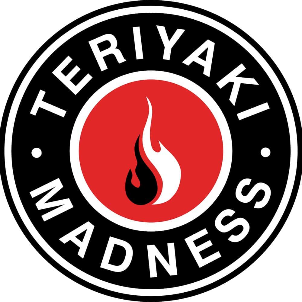 Logo of "Teriyaki Madness," a popular QSR spots in Sandy Springs, GA, featuring a red circle with a black and white flame in the center, surrounded by black text on a circular white and black border.