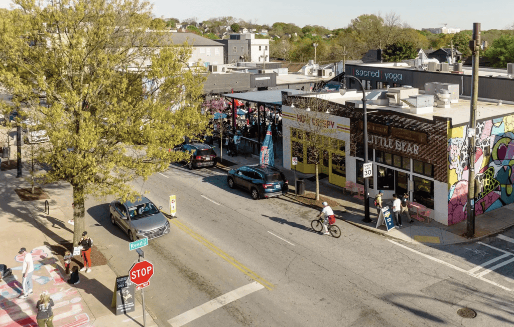 Commercial property in Atlanta with vibrant storefronts and active street scene.
