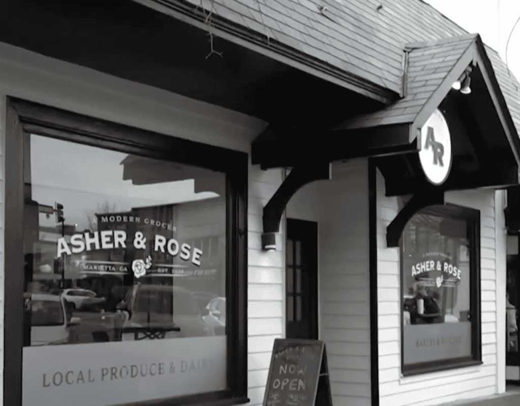 Modern restaurant storefront with "Asher & Rose" signage in Atlanta, Georgia.