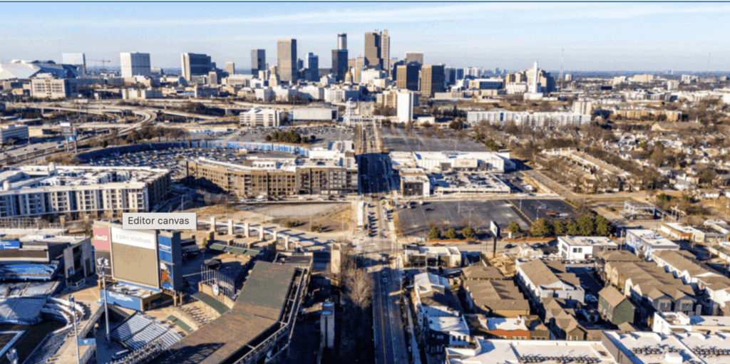 Aerial view of downtown Atlanta, Georgia, showing residential and commercial buildings, streets, and the city skyline in the background.