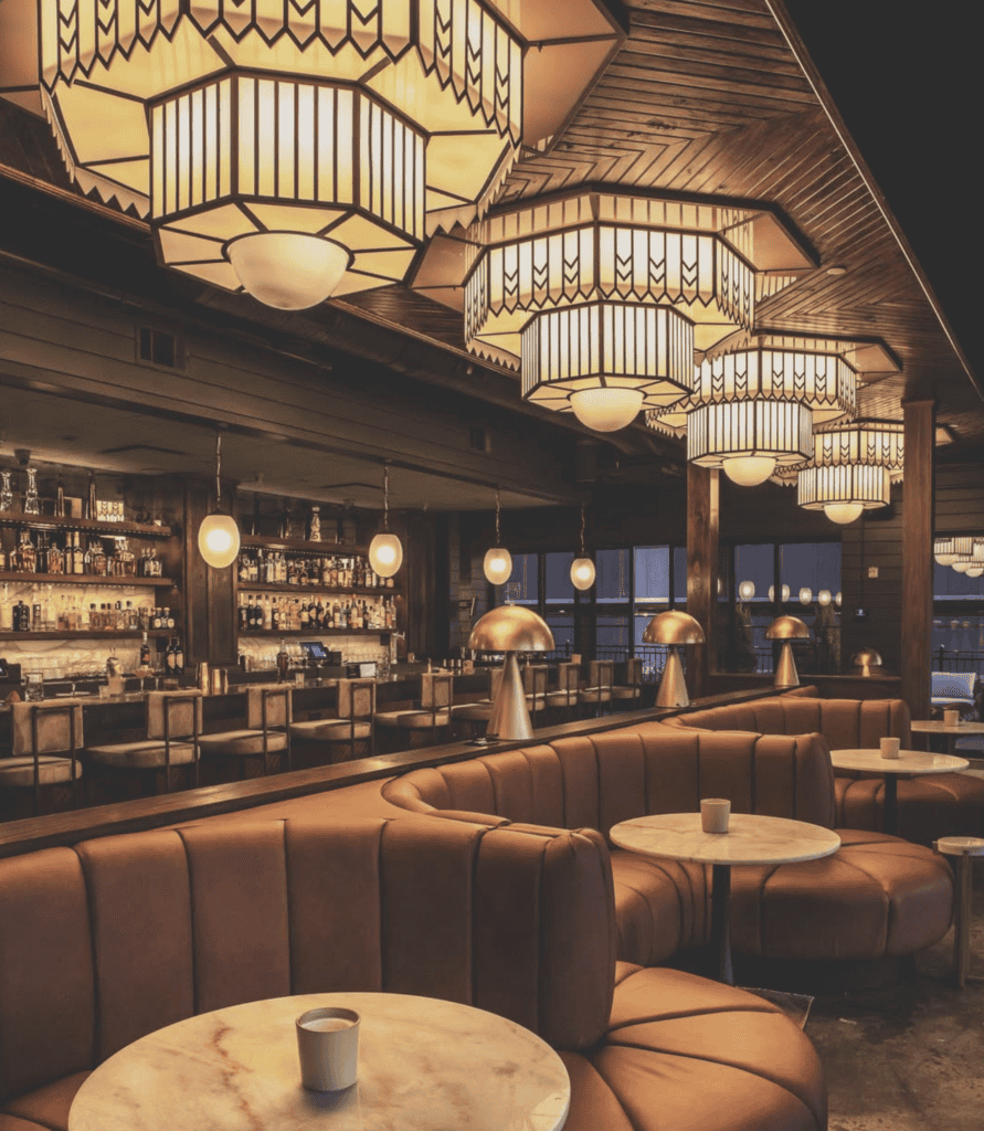Elegant restaurant interior with warm lighting and modern decor.