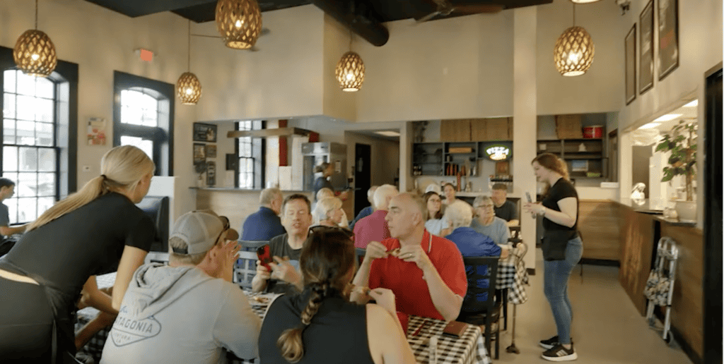 Elegant restaurant interior with diners and staff in Atlanta.