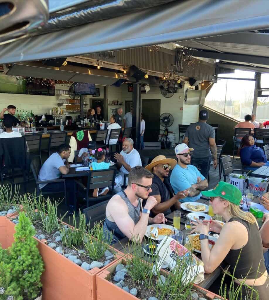Vibrant restaurant scene in Atlanta with diverse diners enjoying meals.