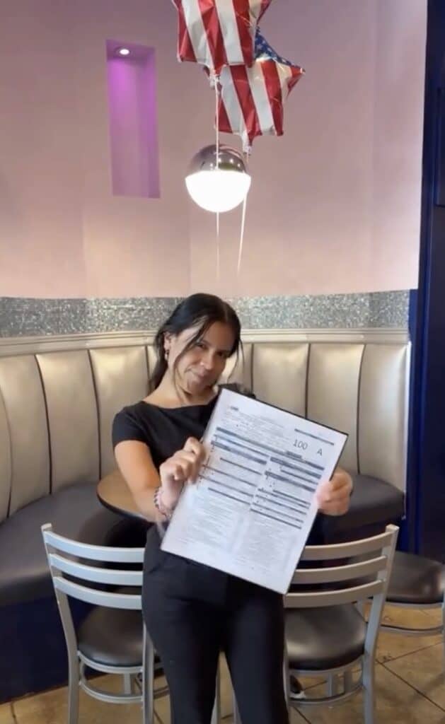 Modern woman holding restaurant lease agreement at Atlanta restaurant real estate broker office.