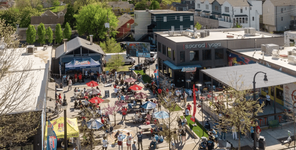 Vibrant outdoor food festival in Atlanta with crowds and colorful tents.