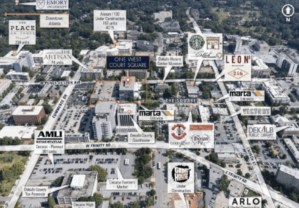 Aerial map of a city area showing labeled landmarks, residential buildings, cafes, MARTA stations, county buildings, and universities with directional markers.