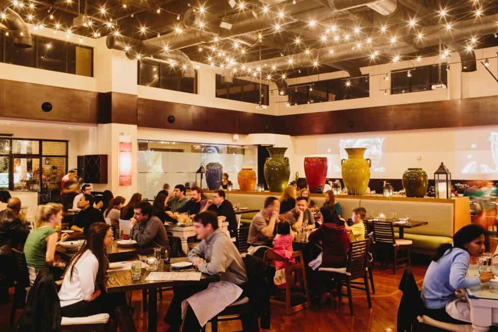 Atlanta restaurant real estate brokers working with clients in a lively restaurant.