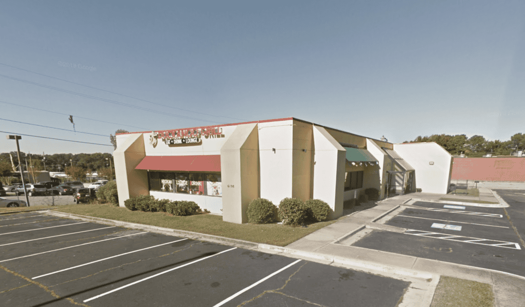 Atlanta restaurant real estate brokers office building with parking lot.
