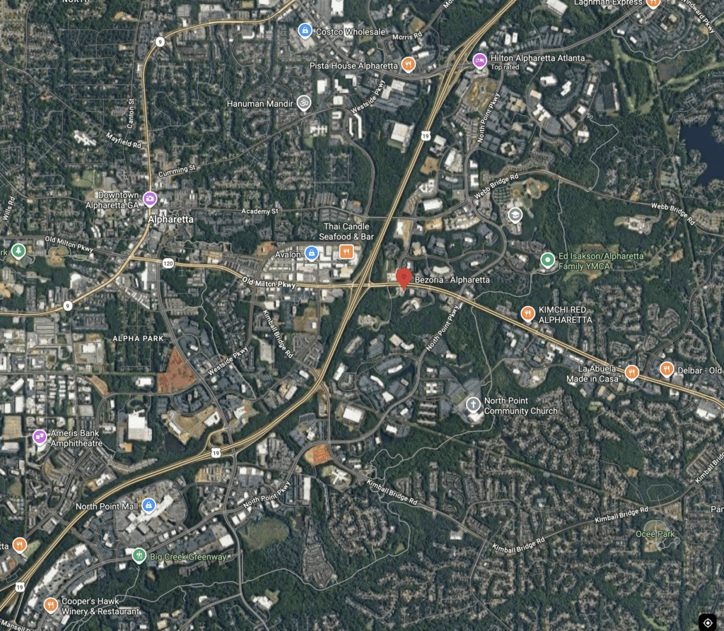 Satellite map view of Alpharetta, Georgia, highlighting a central location with nearby roads, businesses, churches, and green areas visible.